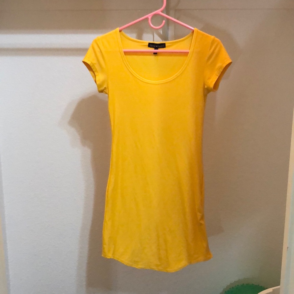 a yellow body-con dress